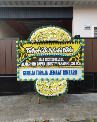Papan Bunga Duka di Unir Sirau